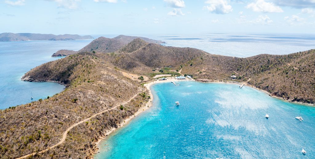 Beautiful aerial shot of Norman Island in BVI on a bright sunny afternoon