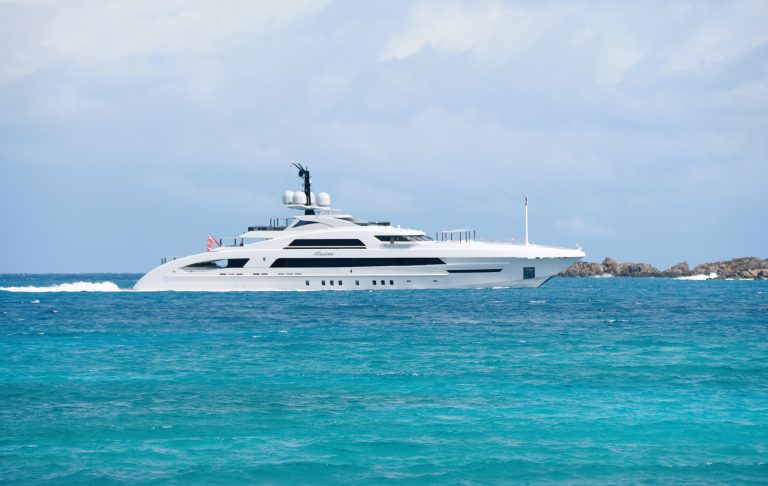 Tortola British Virgin Islands The distance view of Illusion a white luxury yacht sailing on the water