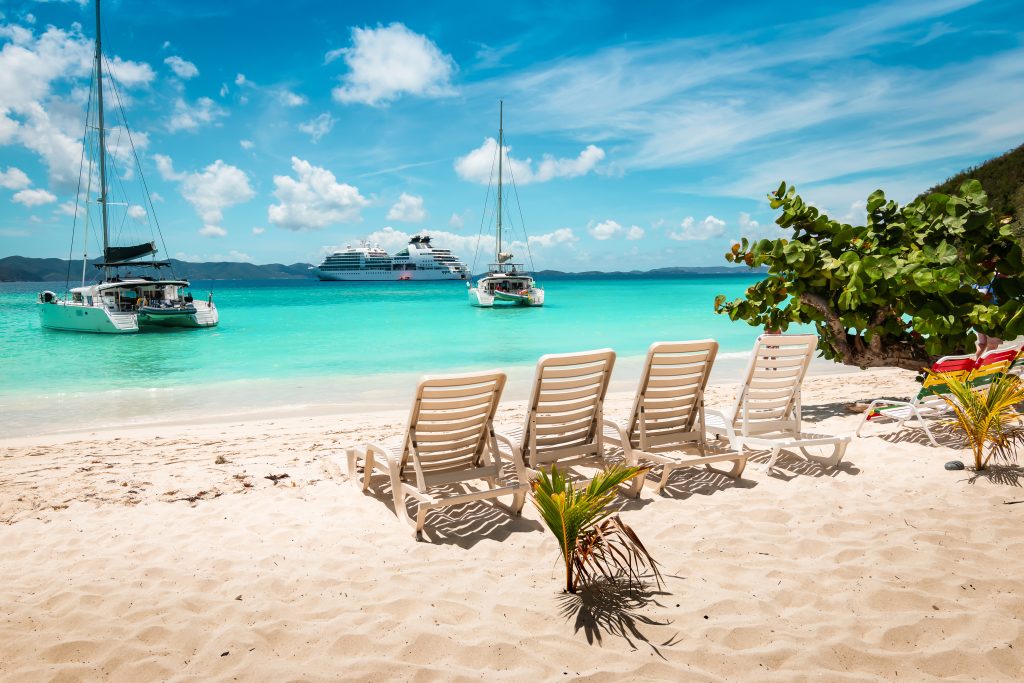 Tropical white sand beach with beach chairs. Jost Van dyke British Virgin Islands