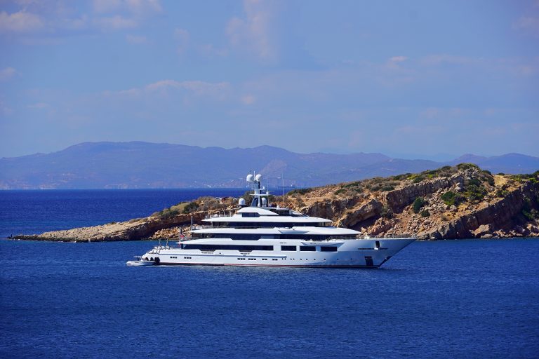 A white motor yacht off the coast of Vouliagmeni, near Athens