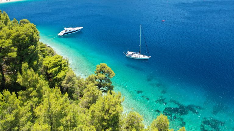 A yacht anchored in the clear bay at Panormos, Skopelos, in the Sporades
