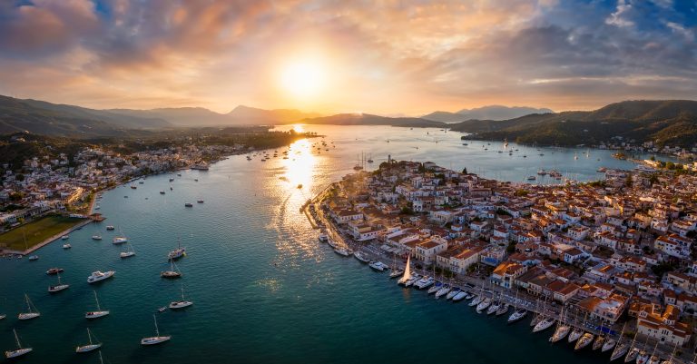 Poros town and harbour at sunset, seen from the air, in the Saronic Gulf