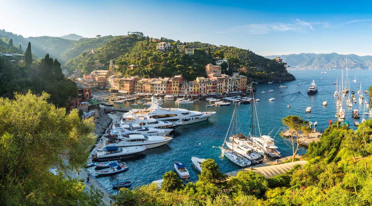 Portofino harbour on the Italian Riviera, with boats moored below the town
