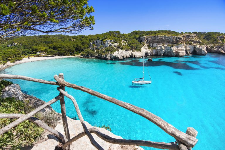 A sailing yacht anchored in Cala Macarella, Menorca