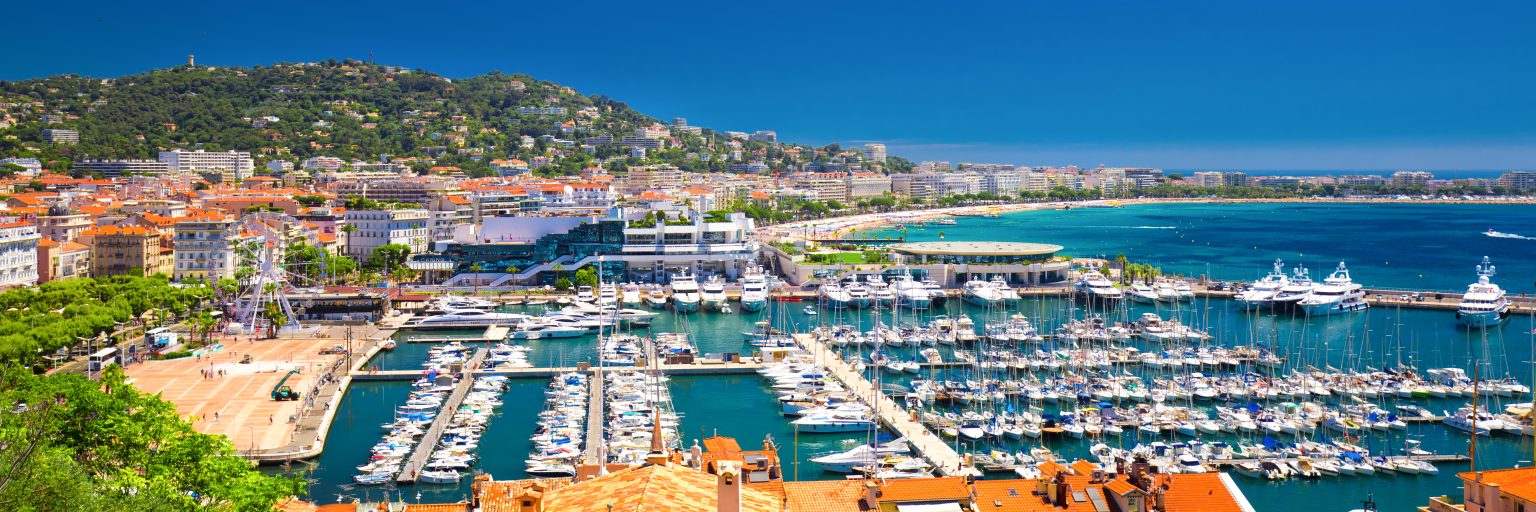 Yachts at anchor off the Cannes seafront on the French Riviera