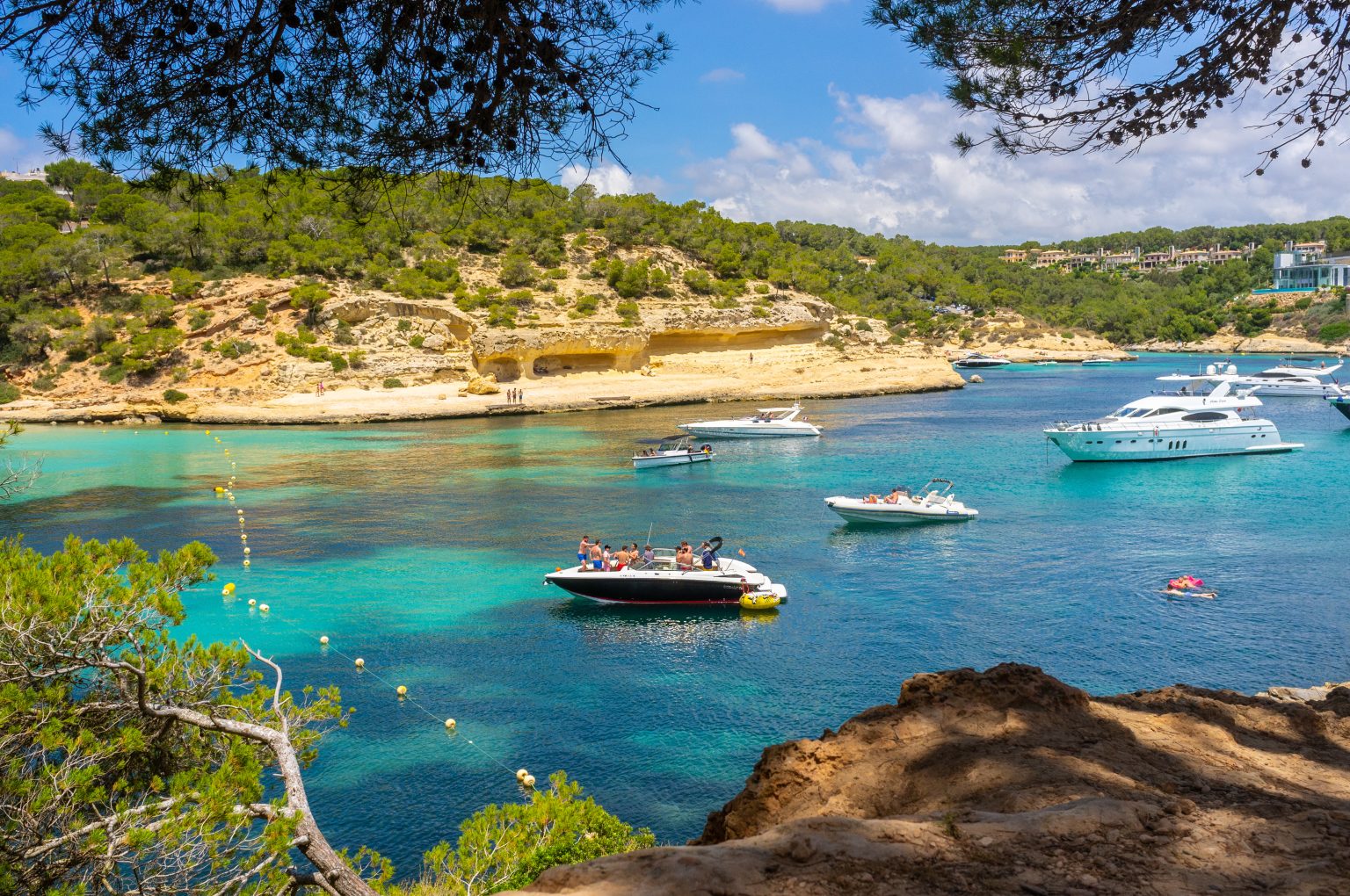 Motor yachts at anchor in the bay at Portals Vells, Mallorca