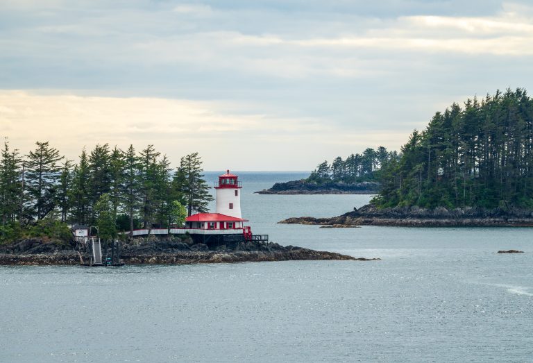 Small lighthouse on a wooded islet outside Sitka, Alaska