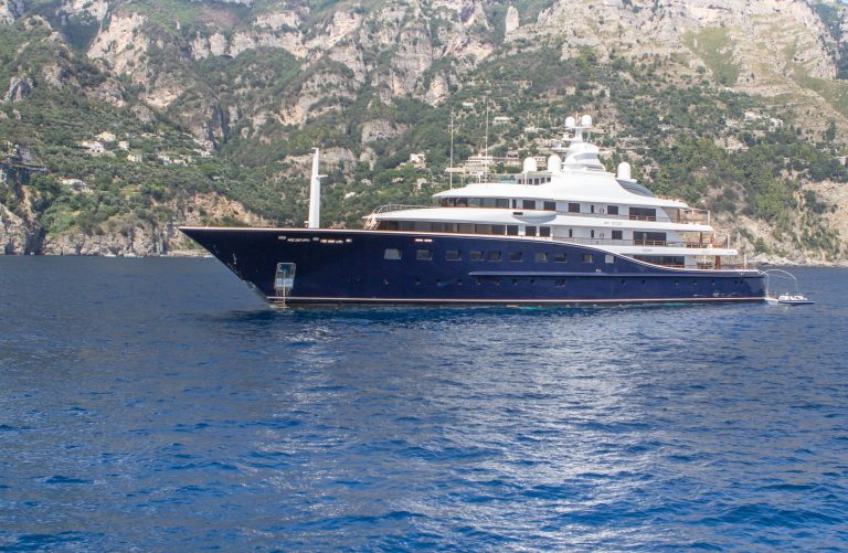 A crewed motor yacht off Positano