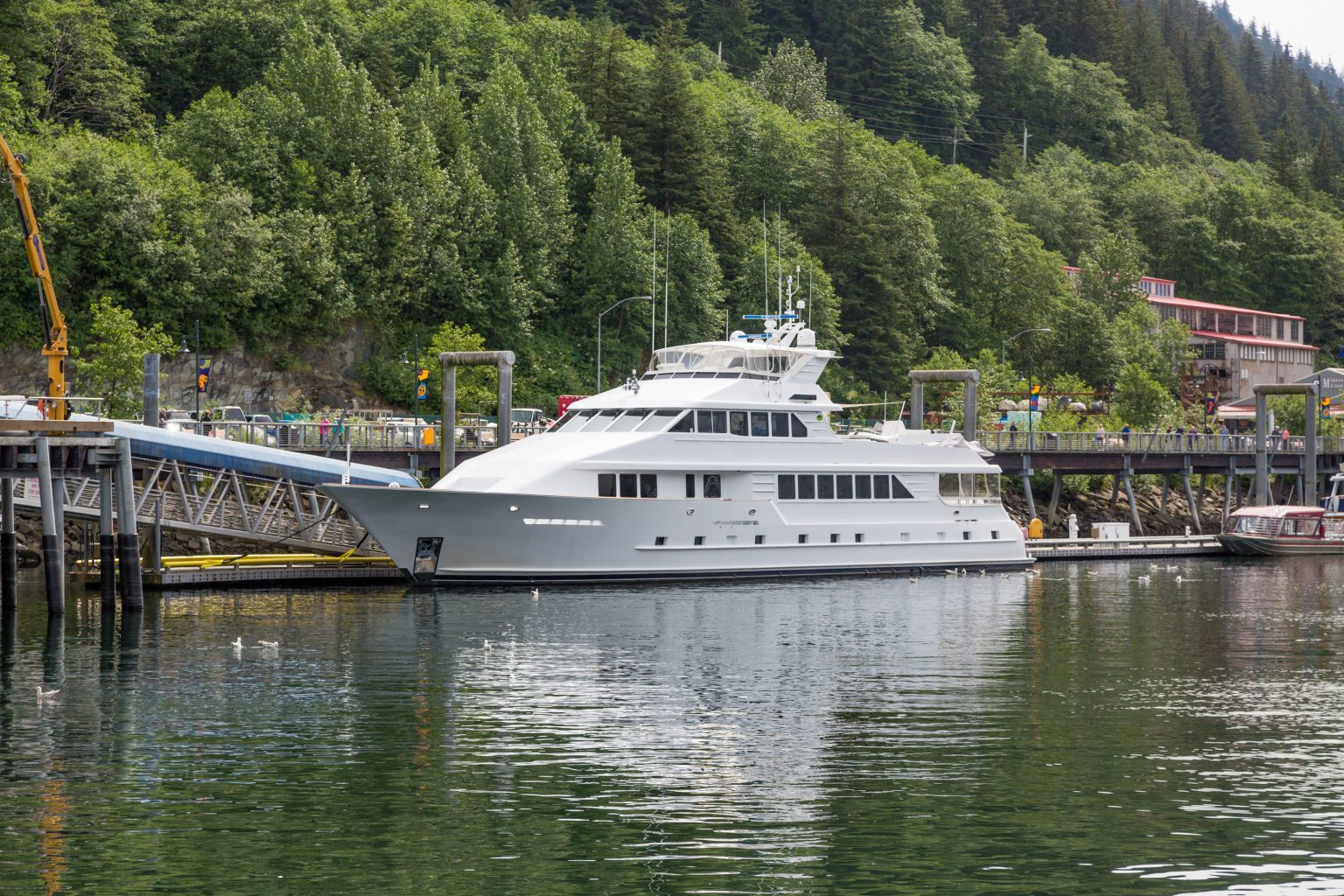Large motor yacht moored at a dock in Juneau, Alaska