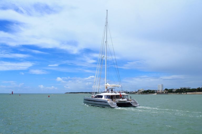 A catamaran under sail at La Rochelle, France