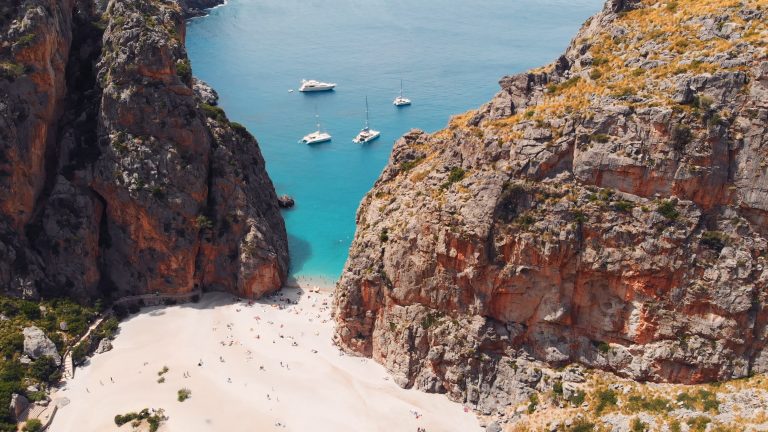 The beach at Sa Calobra between the cliffs of the Torrent de Pareis, Mallorca