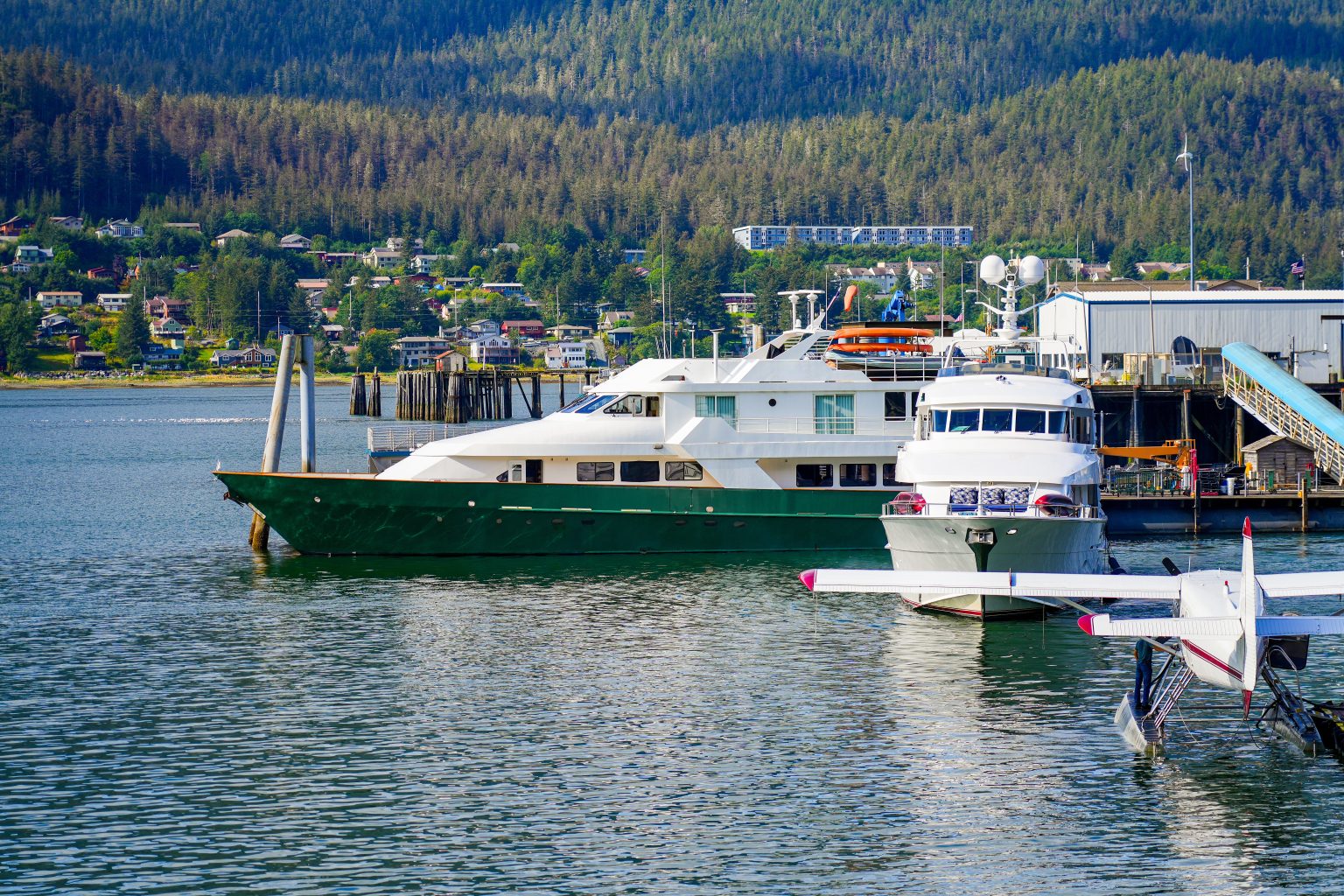 Yacht moored next to a floatplane on the Juneau waterfront, Alaska