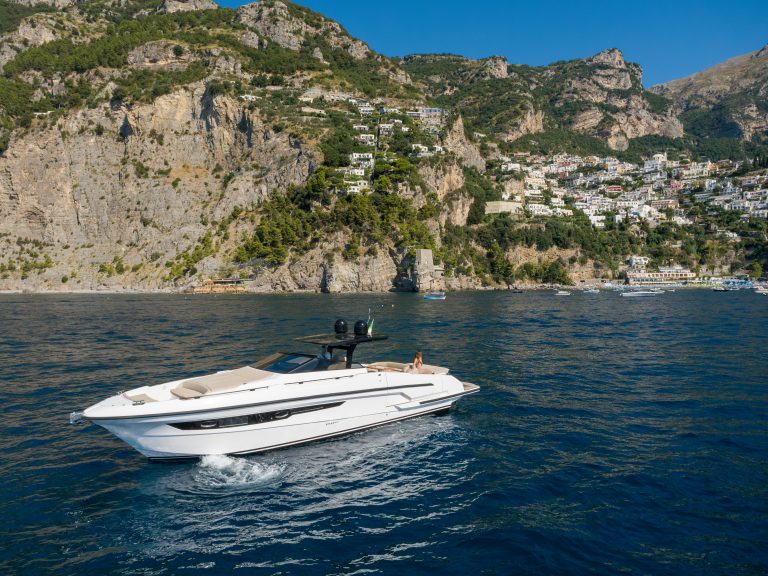 Sunbathing on the foredeck of a yacht off the Amalfi Coast